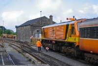Another 201 Class loco, this time No.210, is seen at Westport having arrived from Dublin. In this view is the former stone built goods shed. A shunt signal is seen in the &#39;off&#39; position allowing No.210 to proceed in the direction of Westport Quay.