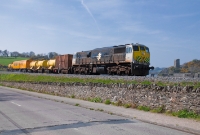071 Class locomotive No.079 runs along the River Slaney north of Wexford town with Irish Rail&#39;s annual weed spraying train from Dublin. In the background is Ferrycarrig Castle.