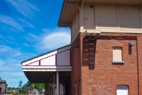 The Belfast Northern Counties Railway Victorian built station buildings at Whitehead. The tall signal cabin, which remained in use until 1988 is a typical BNCR design. Note also the original platform canopy.