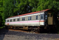 A British Rail Derby built Mk3 sleeper coach, is seen stored at the back of Whitehead yard.