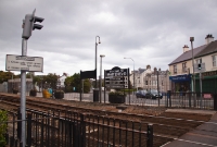 At the north end of the station at Whitehead is the pedestrian level crossing, complete with warning lights and signs. The crossing here originally replaced a footbridge.