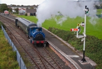 The Guinness loco, No.3BG, is seen at the south end of the RPSI platform at Whitehead while performing &#39;Summer Steam&#39; train rides during an open day. The train consists of a British Rail built Mk2 coach and an ex Great Northern Railway brakevan.