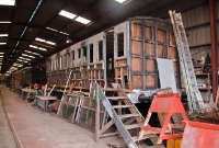 An ex Midland Great Western Railway Victorian era coach, is seen under restorated in the carriage shed at Whitehead.