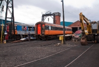 Two 1970s era Derby built Mk2 coaches are seen been attended to at the Whitehead RPSI base, one in NIR blue and the other in Irish Rail black &#38; orange livery.