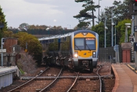 CAF 3000 Class railcar No.3019 returns from Larne Harbour with a service to Belfast, seen approaching the up platform at Whitehead Station.