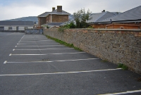 The D&#38;WR Murrough terminus at Wicklow, as viewed from what was the single platform. On the right is the platform retaining wall. Much of the station site is now a car park.