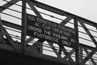 Post-1925 Great Southern Railway bi-lingual footbridge notice, mounted on the 1880s constructed DWWR footbridge at Wicklow Station.