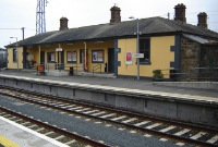 The single storey Dublin Wicklow &#38; Wexford Railway built station building on the down platform at Wicklow. This station replaced the earlier 1885 built terminus station at the Murrough, just north of Wicklow town.