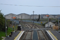 The view from the station footbridge at Wicklow, looking north towards Dublin in the days of semaphore signalling. In the background is the Vartry River.