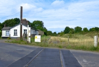 A recent view of Wilkinstown Station, looking north towards Kingscourt from the R162 road, showing the now gateless level crossing.