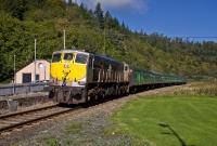 071 Class locomotive No.073 glides past the former junction station at Woodenbridge while operating the Railway Preservation Society of Ireland&#39;s &#39;Best of Both&#39; railtour from Dublin to Arklow, formed of vintage ex CIE stock.