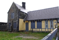 From the station forecourt, the main building at Woodlawn appears to be rundown. Only a small section remains in public railway use.